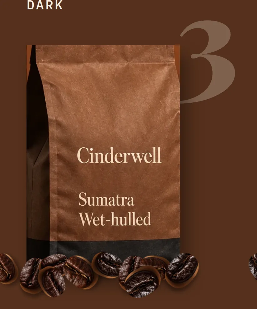 Dark roast card: a darker kraft coffee bag lettered Cinderwell, Sumatra Wet-hulled, with tasting notes and an Add to cart button.